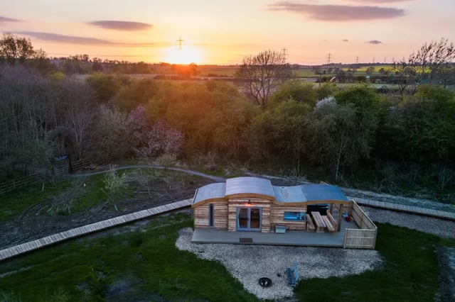 Aerial view of an eco cabin at sunset